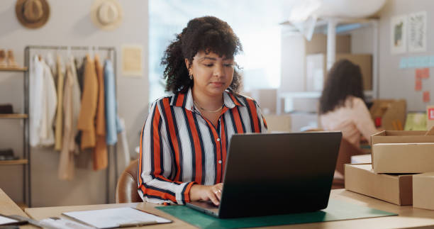 istock Boxes, typing and woman with a laptop, ecommerce and online reading with website information, email and startup. Person, entrepreneur and business owner with a pc, search internet or fashion designer 1847878342