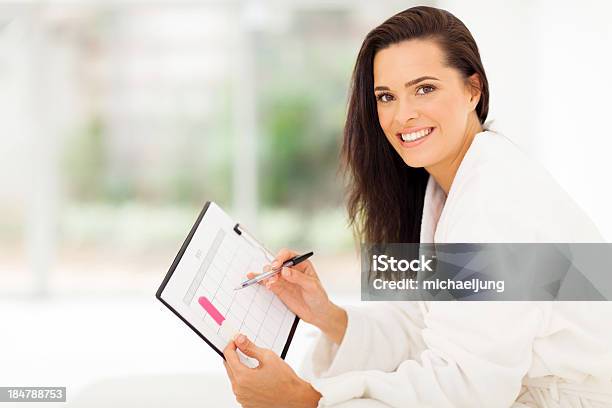 Elegant Young Woman Planning Pregnancy Stock Photo - Download Image Now - Adult, Adults Only, Bathrobe