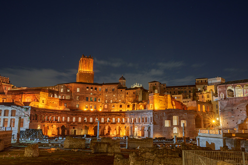 The Basilica Ulpia and the Trajan's Column at night in Rome, Italy.