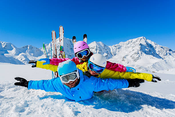 istock Family enjoying winter ski vacation 184790004