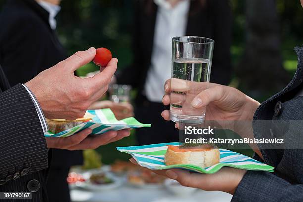 Discussing Business People With Snacks Stock Photo - Download Image Now - Adult, Appetizer, Banquet