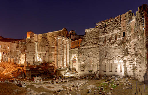 The Basilica Ulpia and the Trajan's Column at night in Rome, Italy.