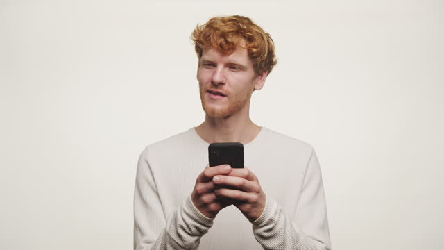 Ginger Guy Thinking Before Texting Back on White Background