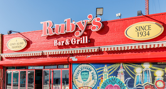 Brooklyn, New York City, USA - February 18, 2023: Facade of Ruby's Bar and Grill beachfront restaurant in Coney Island closed on a winter day