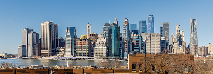 Brooklyn, New York, USA - February 11, 2023: View of Manhattan business district from Brooklyn on a winter day