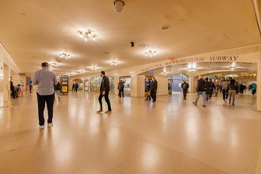 New York City, USA - February 16, 2023: Grand Central Terminal train station in midtown Manhattan with people walking on a winter day