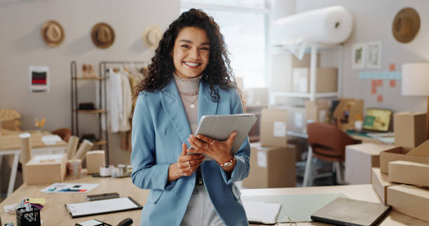 istock Portrait, boxes and woman with a tablet, ecommerce and smile with connection, internet and delivery with company website. Face, person or employee with technology, shipping or online order with sales 1847936497