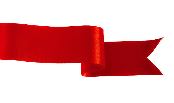 istock Red satin ribbon weaving through a white background 184793666
