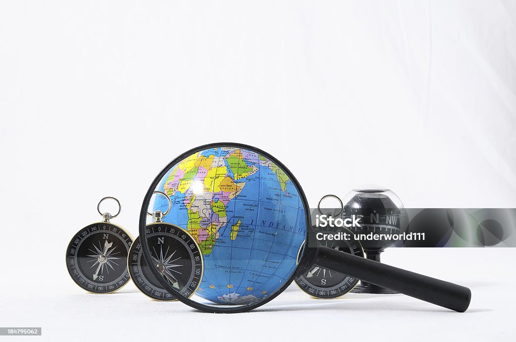 Orientation Concept Orientation Concept Earth,Magnify Glass and Compass on a White Background Camping Stock Photo