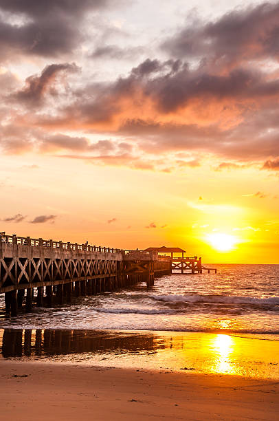istock bridge in amazing sunrise Thailand 184795429