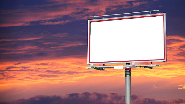istock Blank white billboard over evening sky for your advertisement 184795584