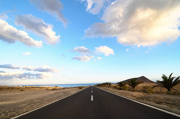 istock Lonely Road in the Desert 184795802
