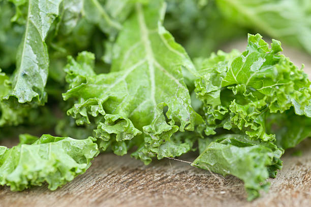 istock Bunch of freshly cut kale salad leaves 184795873