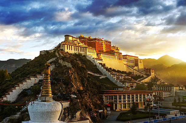 Magnificent view of Potala Palace in the hill at sunrise stock photo