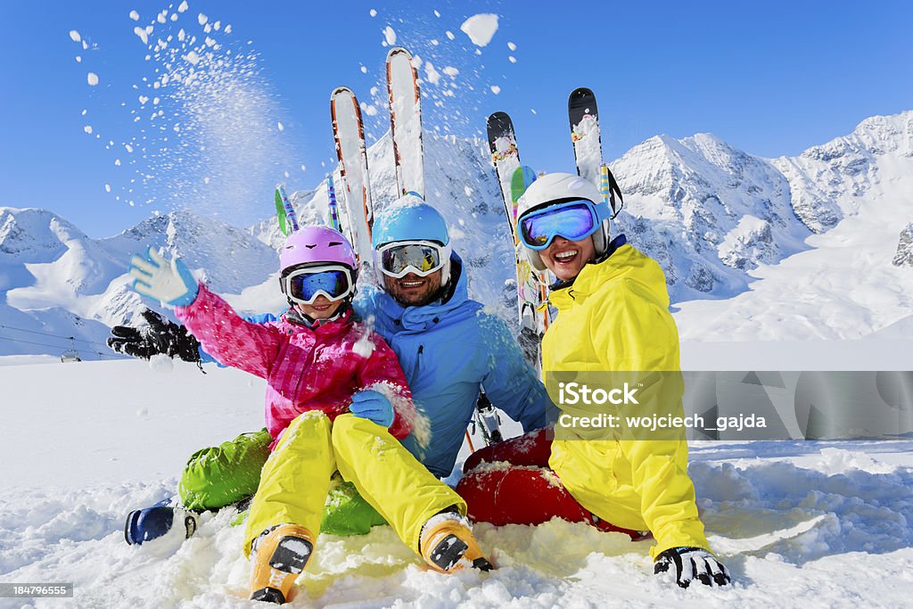 Family enjoying winter ski vacation Skiing, winter, snow,  skiers, sun and fun - family enjoying winter vacationsSkiing family winter, snow,  skiers, sun and fun. Family Stock Photo