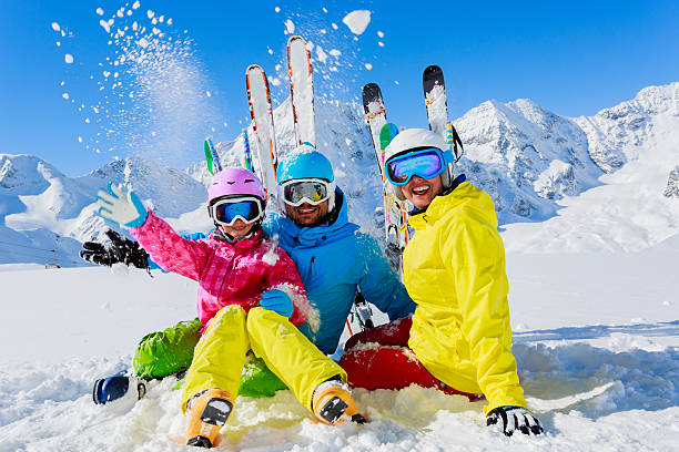 Family enjoying winter ski vacation stock photo