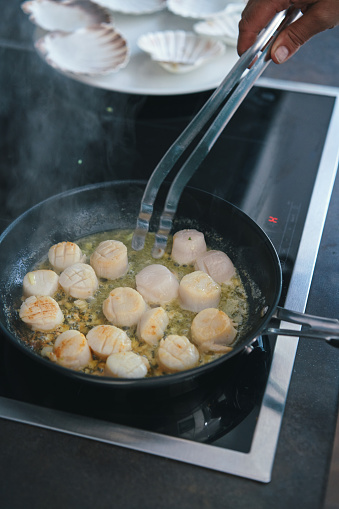 Preparing Scallops in a Cooking Pan
