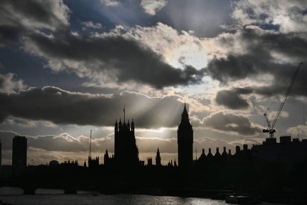 The Houses of Parliament in London with dramatic clouds
