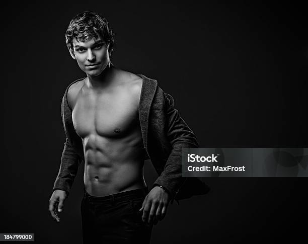 Young Handsome Macho Man With Muscle Abdominal And Open Jacket Stock Photo - Download Image Now