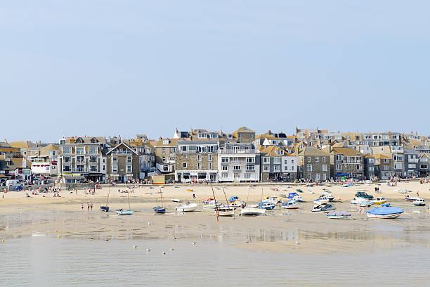 St Ives in Cornwall on a sunny day during the summer showing fishing boats and beach