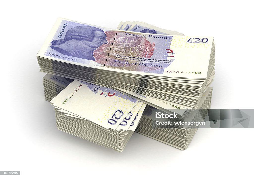 Large stack of twenty pound notes Stack of Pound (isolated with clipping path) British Currency Stock Photo