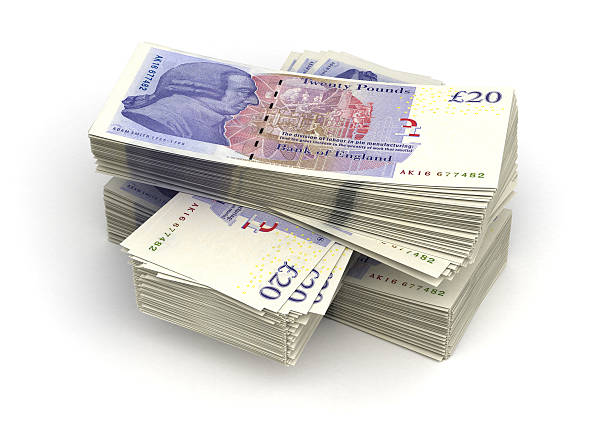 Large stack of twenty pound notes Stack of Pound (isolated with clipping path) british currency stock pictures, royalty-free photos & images