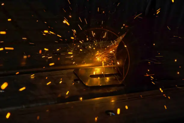 Photo of Sparks are generated during welding process of argon gas to steel at factory area