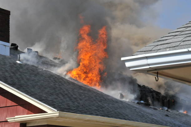 istock Flames break through the roof during a house fire 1848015567