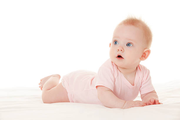 istock Cute baby with beautiful blue eyes on the white bed 184801958