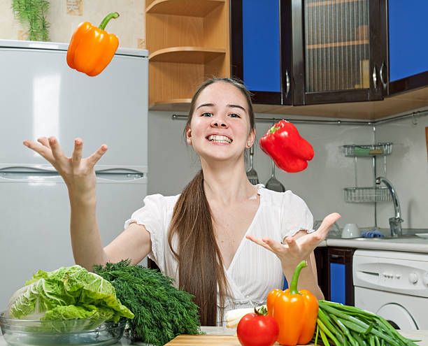 istock young beautiful caucasian woman in the kitchen 184802121