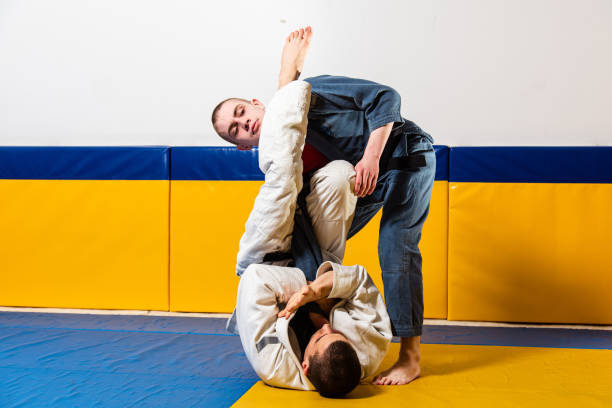 istock Brazilian jiu-jitsu and grappling training for men in a self-defense gym 1848032967
