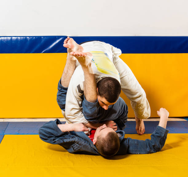 istock Brazilian jiu-jitsu and grappling training for men in a self-defense gym 1848034043