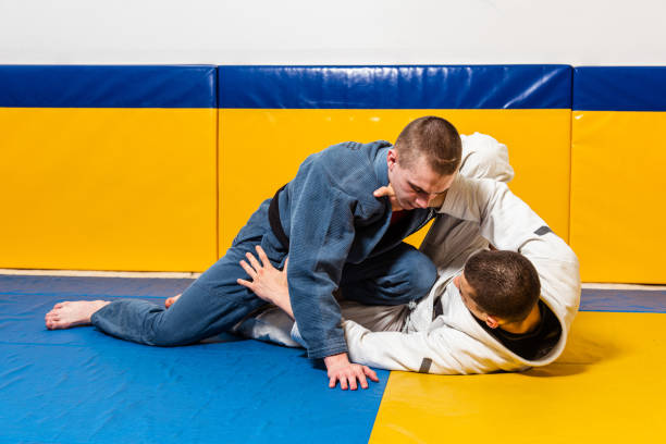 istock Brazilian jiu-jitsu and grappling training for men in a self-defense gym 1848034082