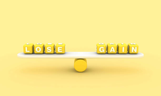 istock Seesaw with LOSE GAIN Buzzword Cubes 1848045847