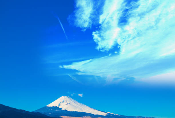 Material for Japanese New Year's cards: A dragon, the zodiac sign of 2024, is flying above Mt. Fuji.　Composite of images taken of actual clouds