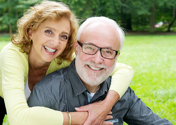 istock Happy older couple smiling  and showing affection 184805208