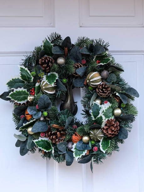 istock Christmas wreath on a white wooden door 1848055679