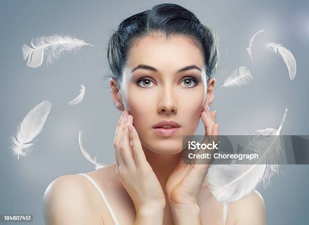 Dreaming With White Feathers Falling Stock Photo - Download Image Now - Feather, Human Face, 20-29 Years