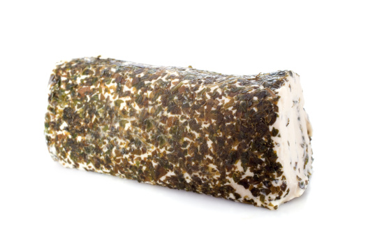 garlic and herb cheese in front of white background