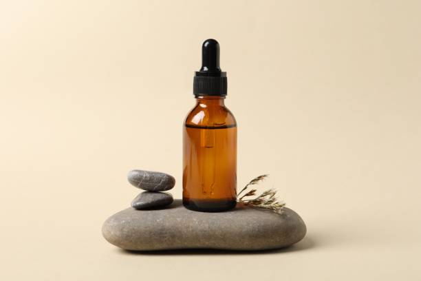 istock Composition with bottle of cosmetic serum on beige background 1848088247