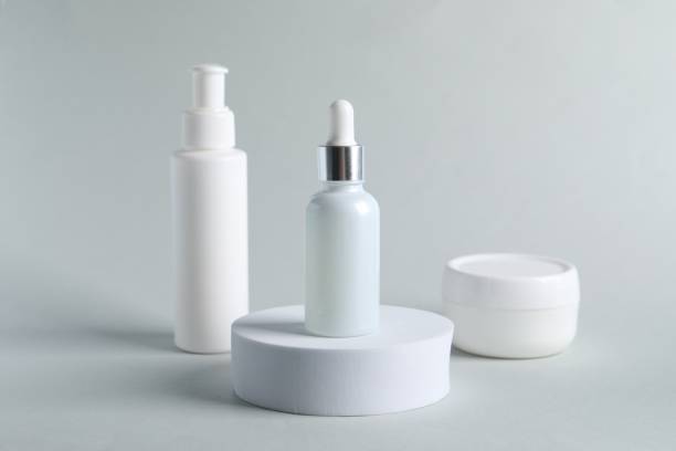 istock Bottles with cosmetic serums on light grey background 1848090870