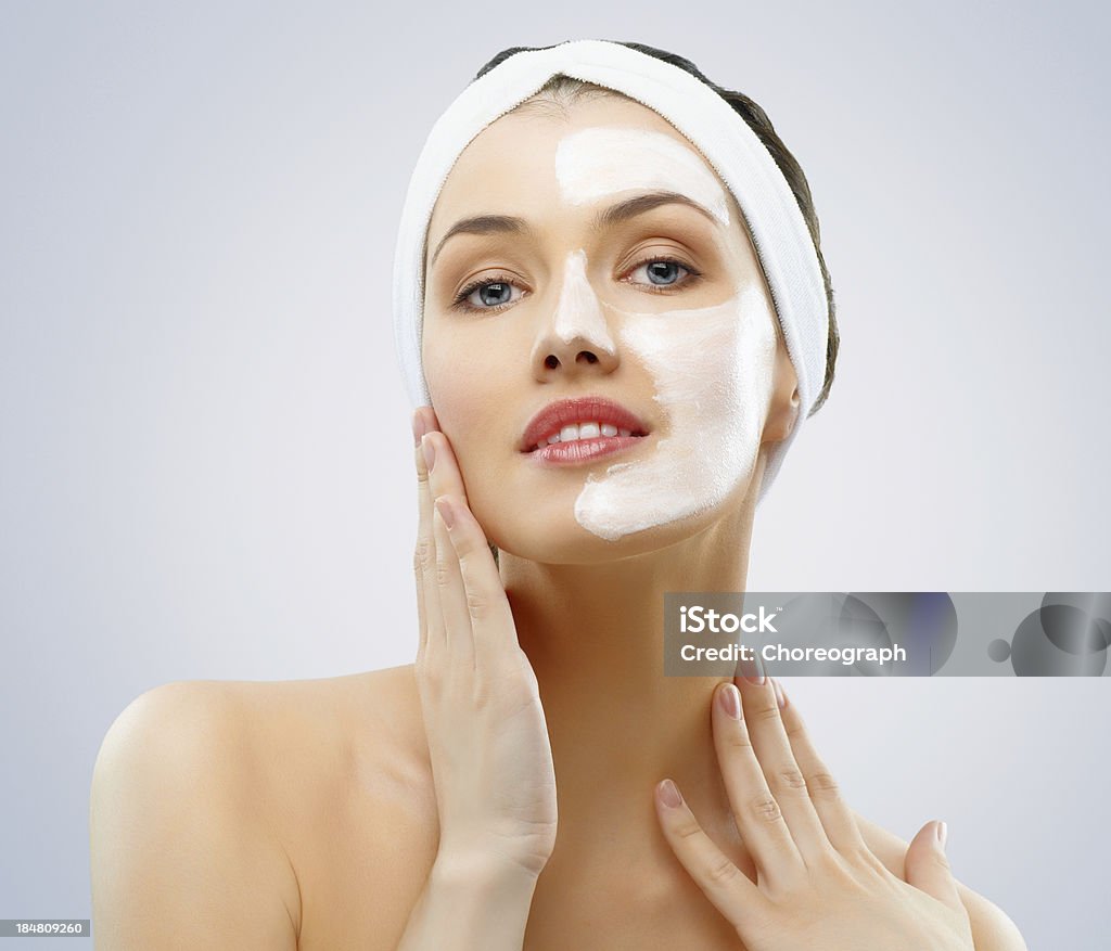 cosmetic mask beauty woman getting facial mask Adult Stock Photo