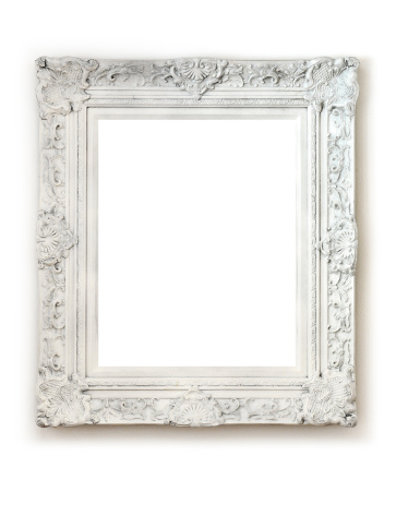 Vintage empty frame isolated on white wall.