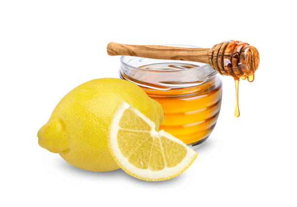 istock Lemon and honey isolated on white background. 1848100010