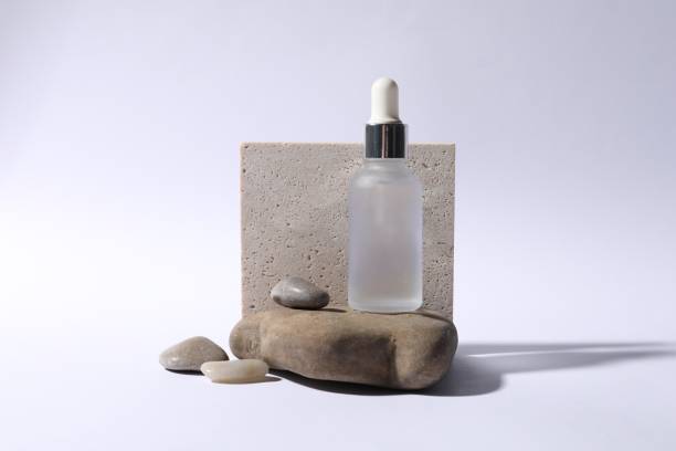 istock Composition with bottle of cosmetic serum on white background 1848109027