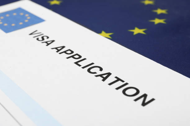 istock Immigration to Europe. Visa application form on flag, closeup 1848109401