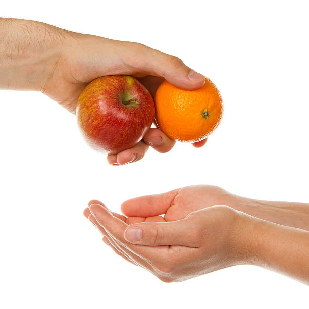 istock Giving an apple and orange 184811275