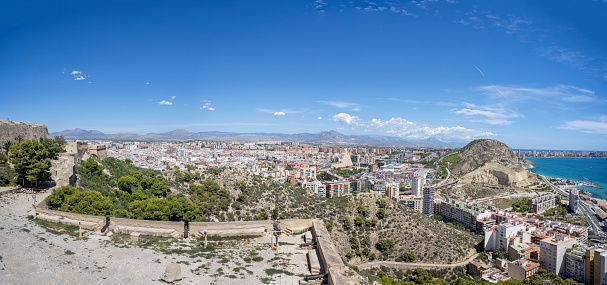 Panoramic landscape looking east along the Alicante coast from Santa Barbara hilltop Castle in Alicante, Spain on 29 August 2023