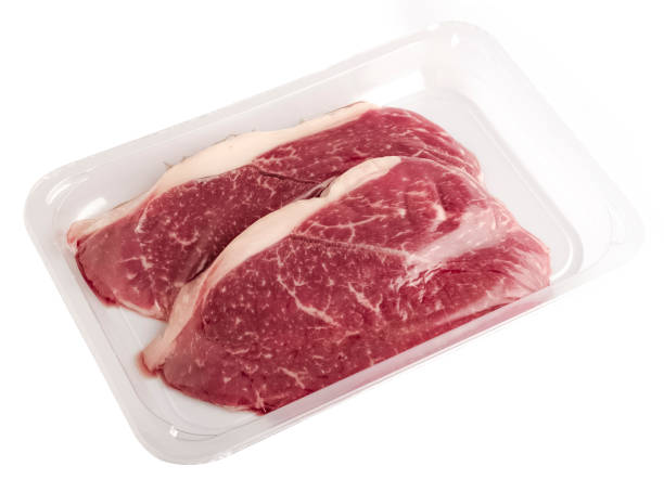 istock Raw beef steaks in vacuum packaging on a white background. isolated object 1848124950