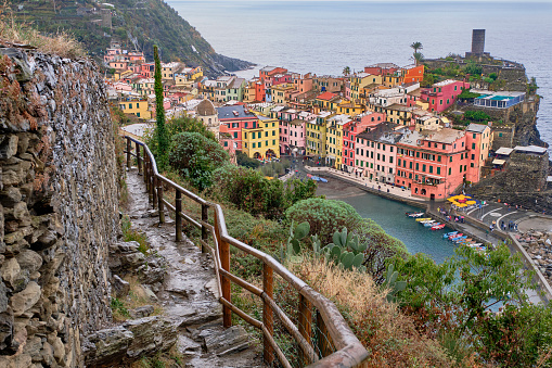 A view from a hiking trail above the  colourful village of Vernazza, part of Cinque Terre Italy on the Medittereanean coast.